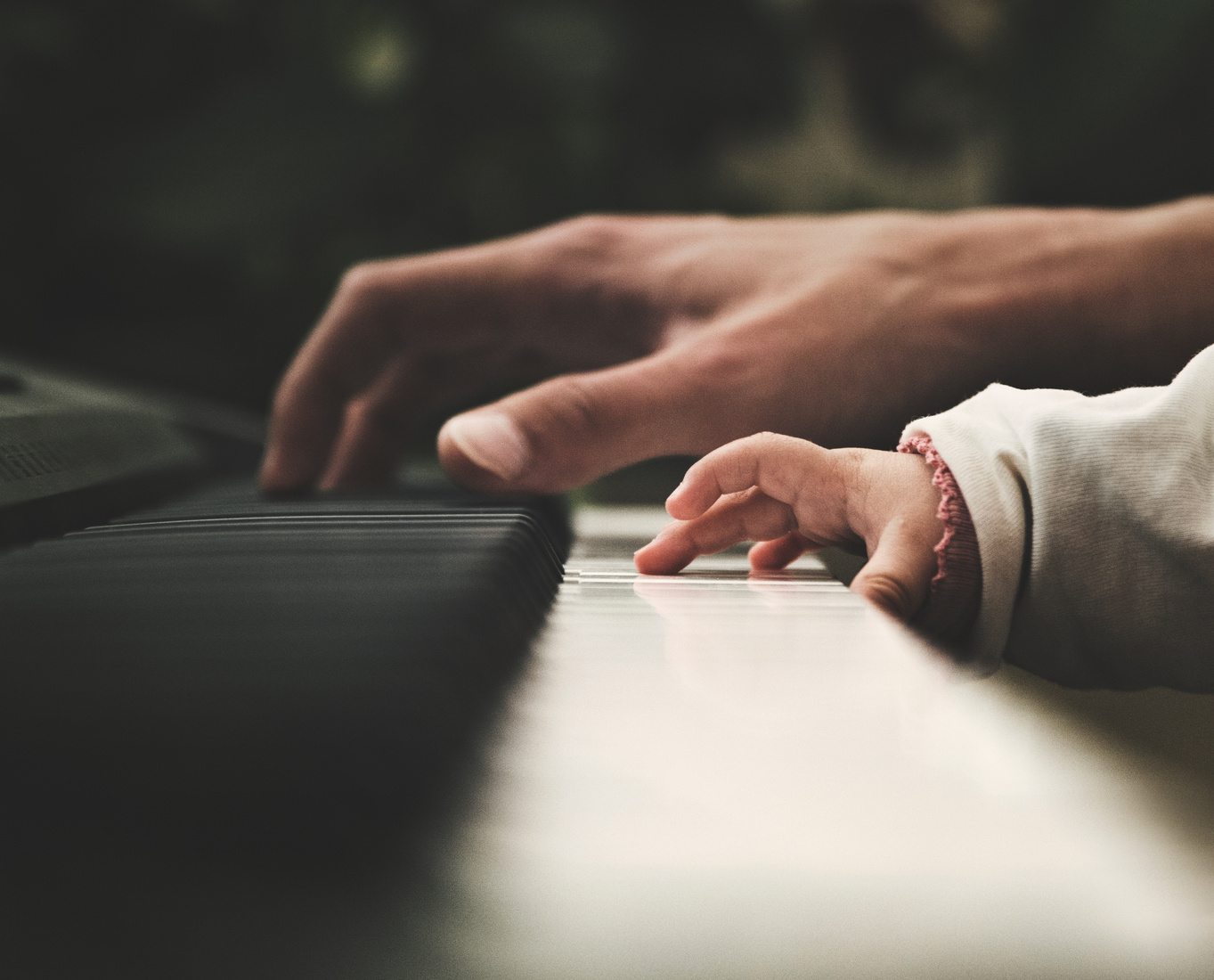 Kid and Parent Playing the Piano